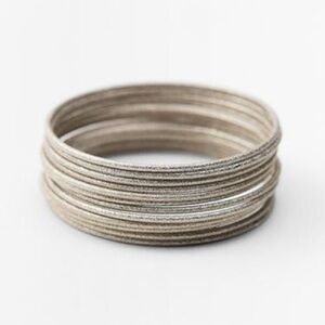 NWT. Zara Silver Set of Metal Bracelets with Relief Pattern.